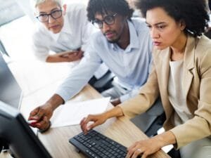 successful-business-group-of-people-at-work-in-off-XPUHYME-scaled